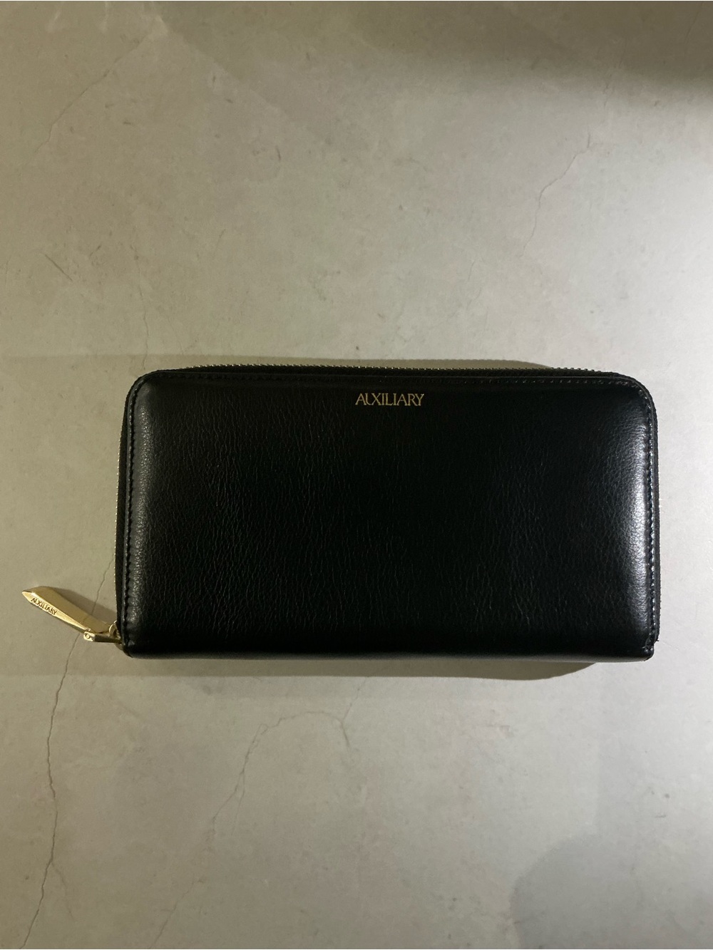Auxiliary Black Zippy Wallet with Gold Accents